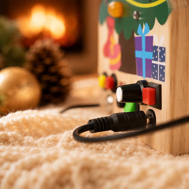 Busy Board Toy with Switches, Lights and Christmas Tree Design